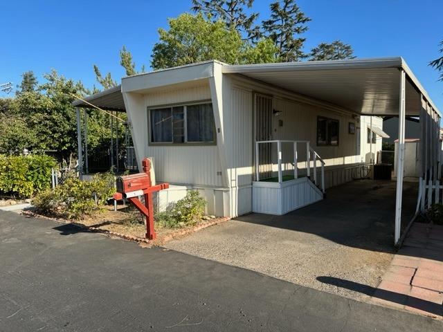 a view of a patio with table and chairs and potted plants