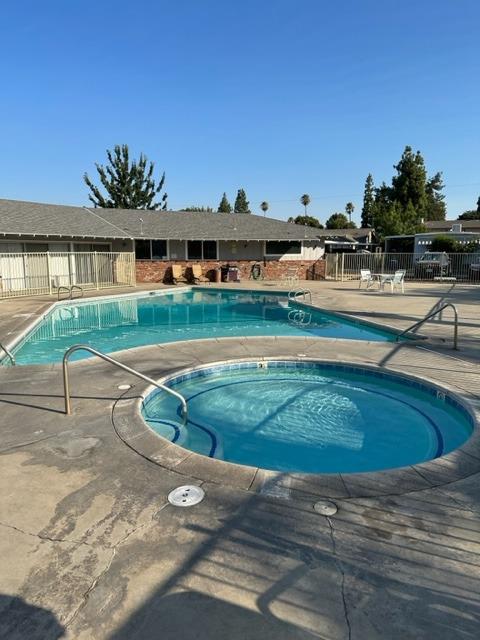 1272 Villa Avenue, Unit 1 Clovis, CA 93612 - Photo 18 of 18 a view of a swimming pool with a yard and plants