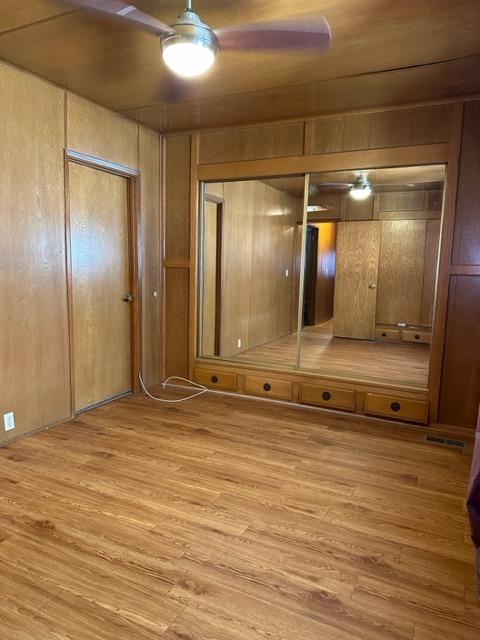 1272 Villa Avenue, Unit 1 Clovis, CA 93612 - Photo 3 of 18 a view of a room with wooden floor and mirror
