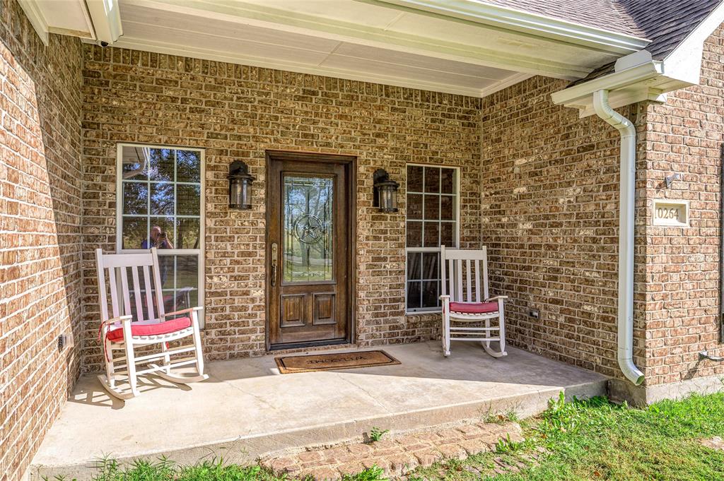 10264 Farmington Road Van Alstyne, TX 75495 - Photo 7 of 39 a building with table and chairs
