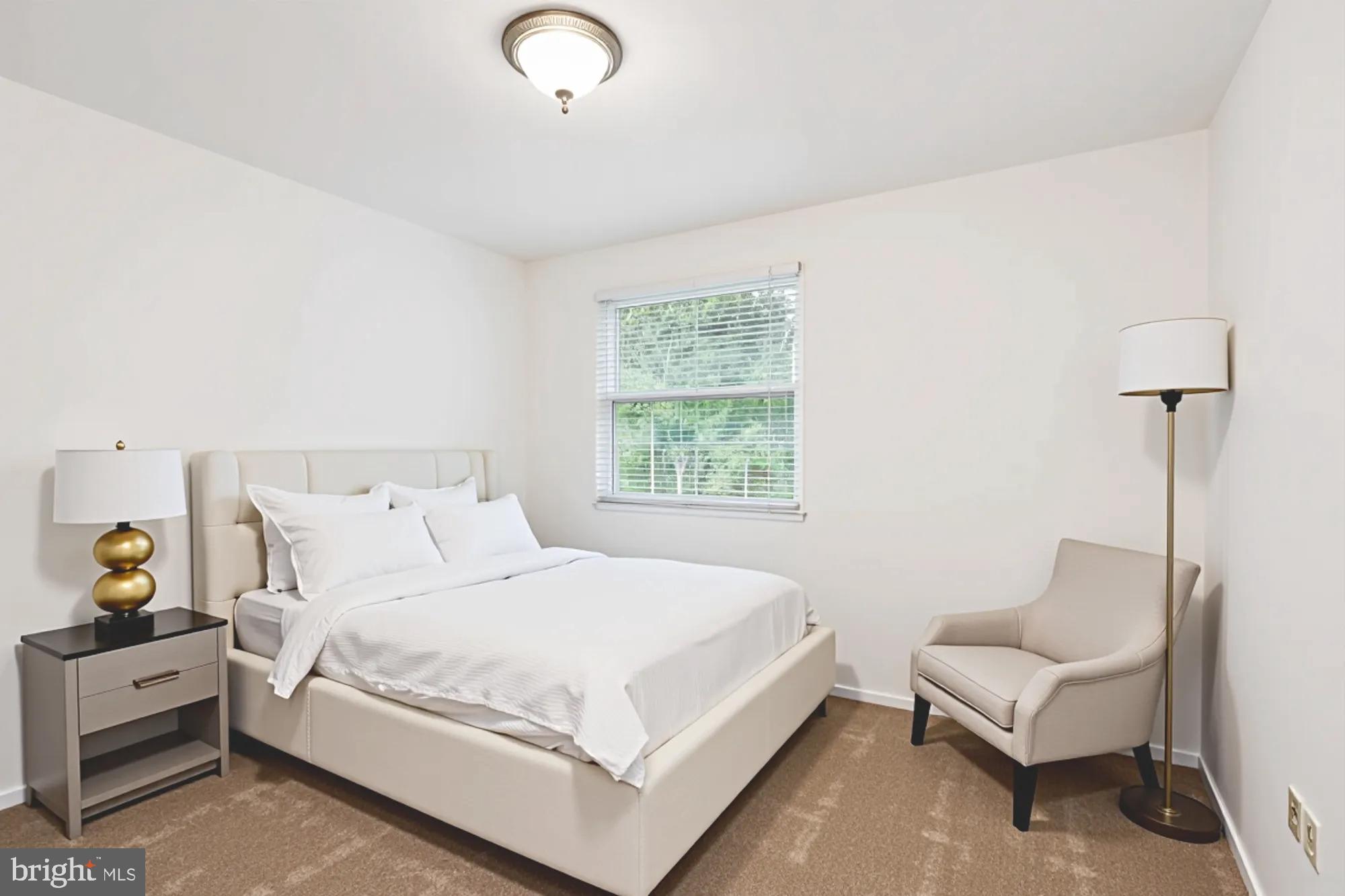 10921 Harpers Square Court Reston, VA 20191 - Photo 14 of 33 a bedroom with a bed and a couch