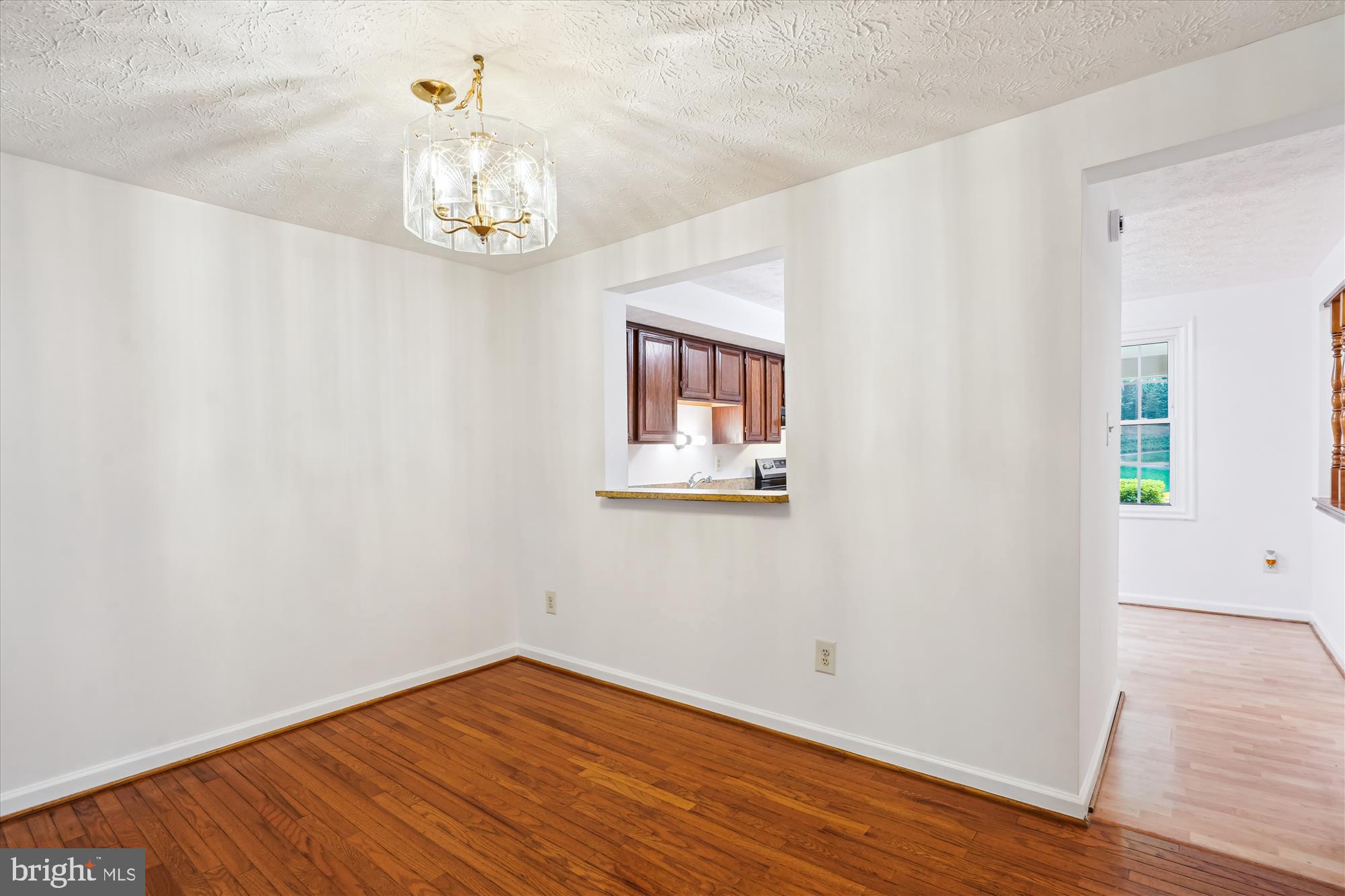10921 Harpers Square Court Reston, VA 20191 - Photo 23 of 33 wooden floor in an empty room with a window