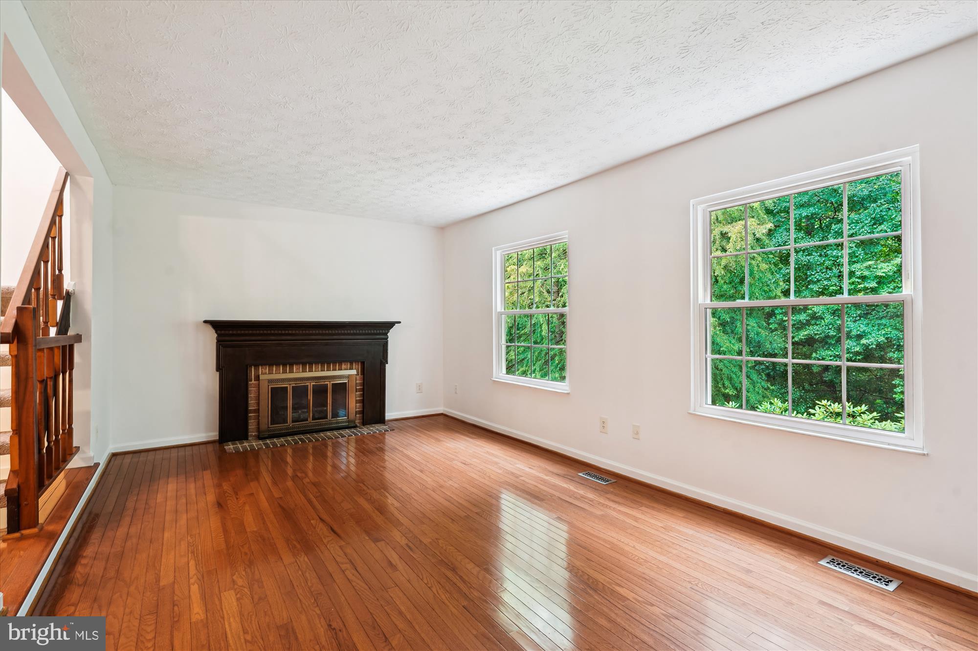 10921 Harpers Square Court Reston, VA 20191 - Photo 24 of 33 a view of an empty room with wooden floor and a window