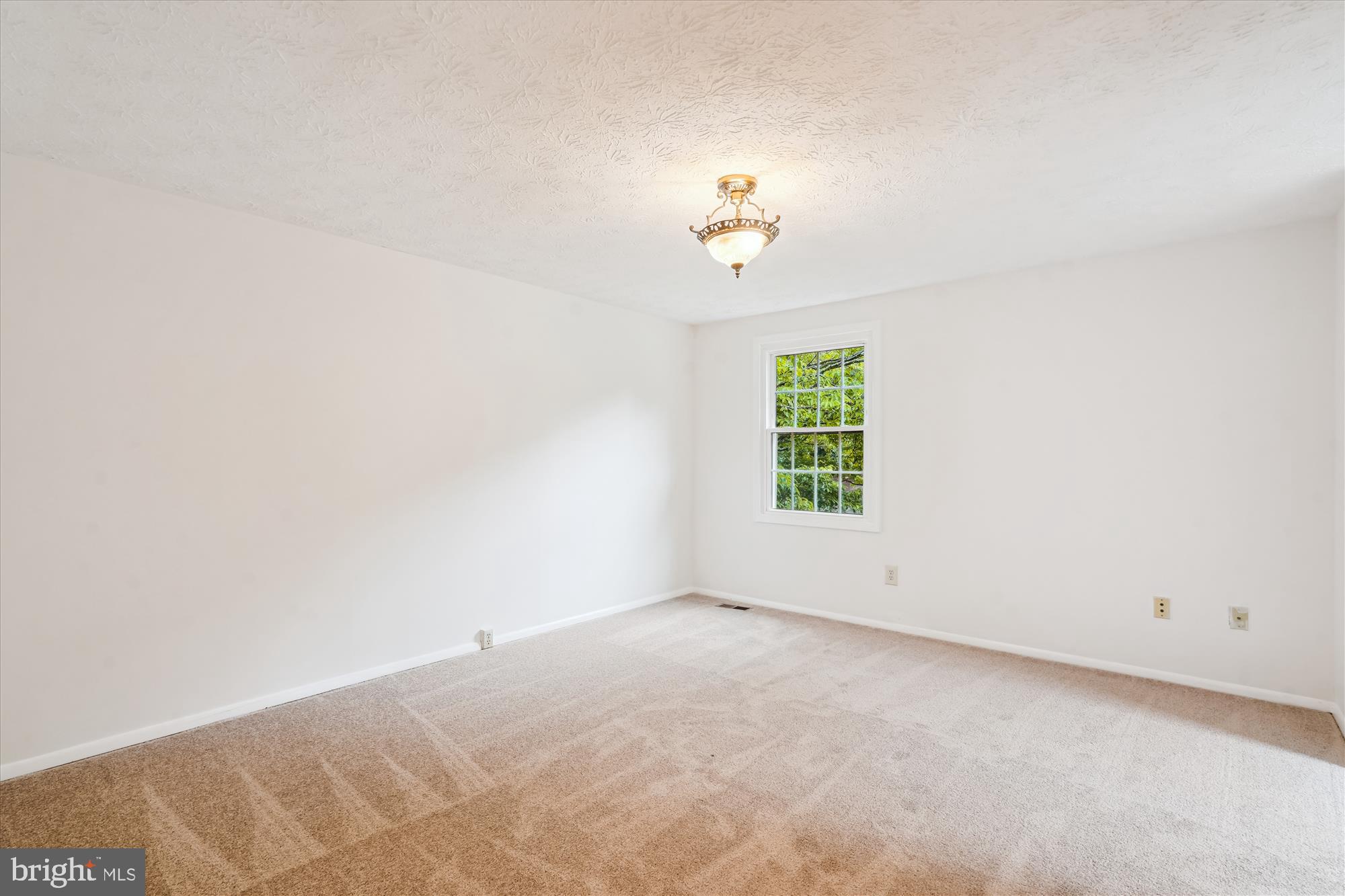 10921 Harpers Square Court Reston, VA 20191 - Photo 26 of 33 an empty room with windows and with white walls
