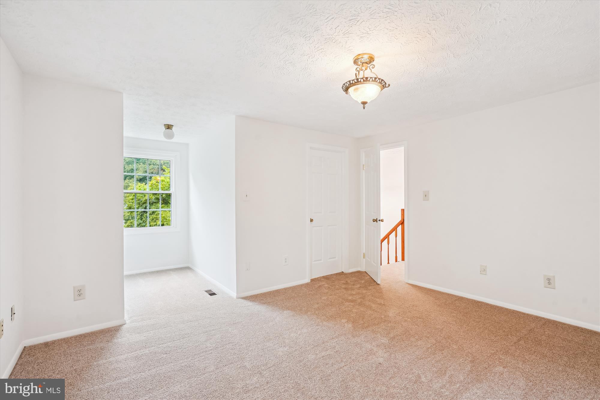 10921 Harpers Square Court Reston, VA 20191 - Photo 27 of 33 a view of a room with a ceiling fan and a window