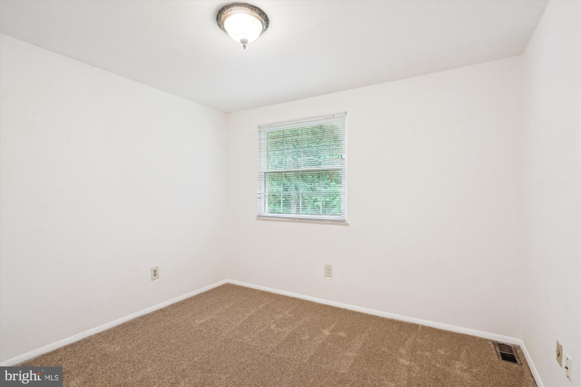 10921 Harpers Square Court Reston, VA 20191 - Photo 31 of 33 an empty room with a window