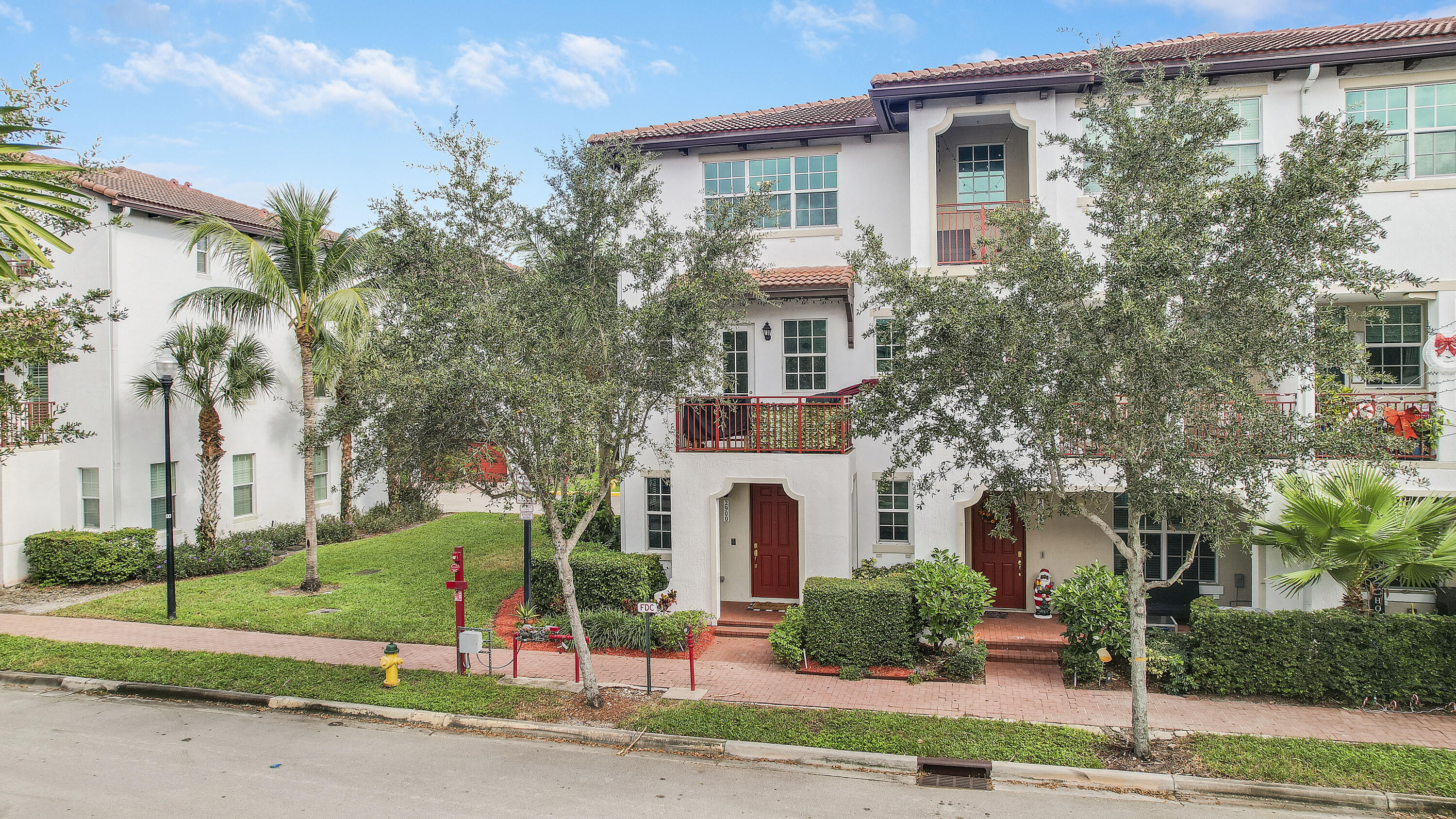 2900 Southwest 119th Way Miramar, FL 33025 - Photo 1 of 37 a front view of a house with a garden and plants