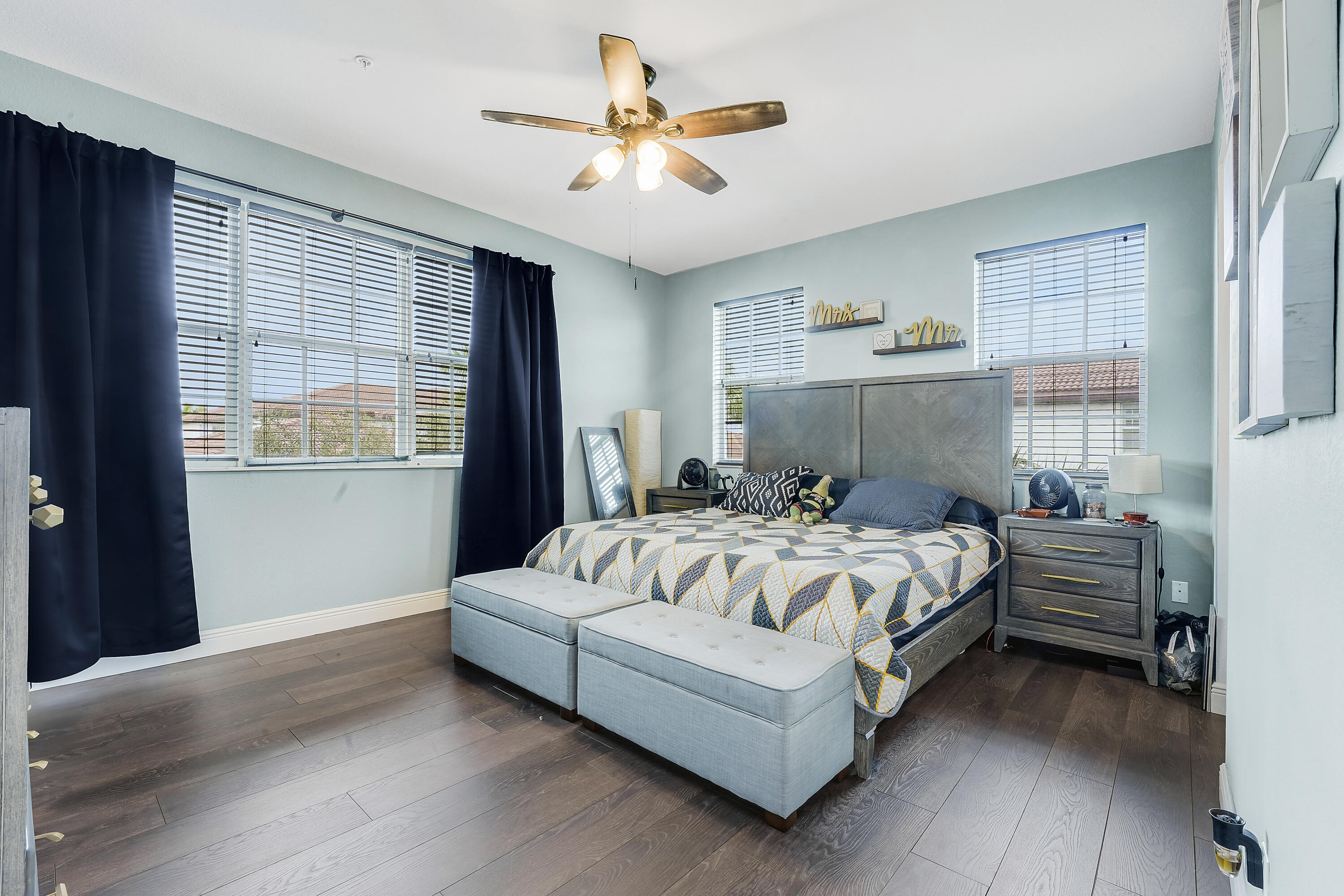 2900 Southwest 119th Way Miramar, FL 33025 - Photo 33 of 37 a bedroom with bed and a chandelier