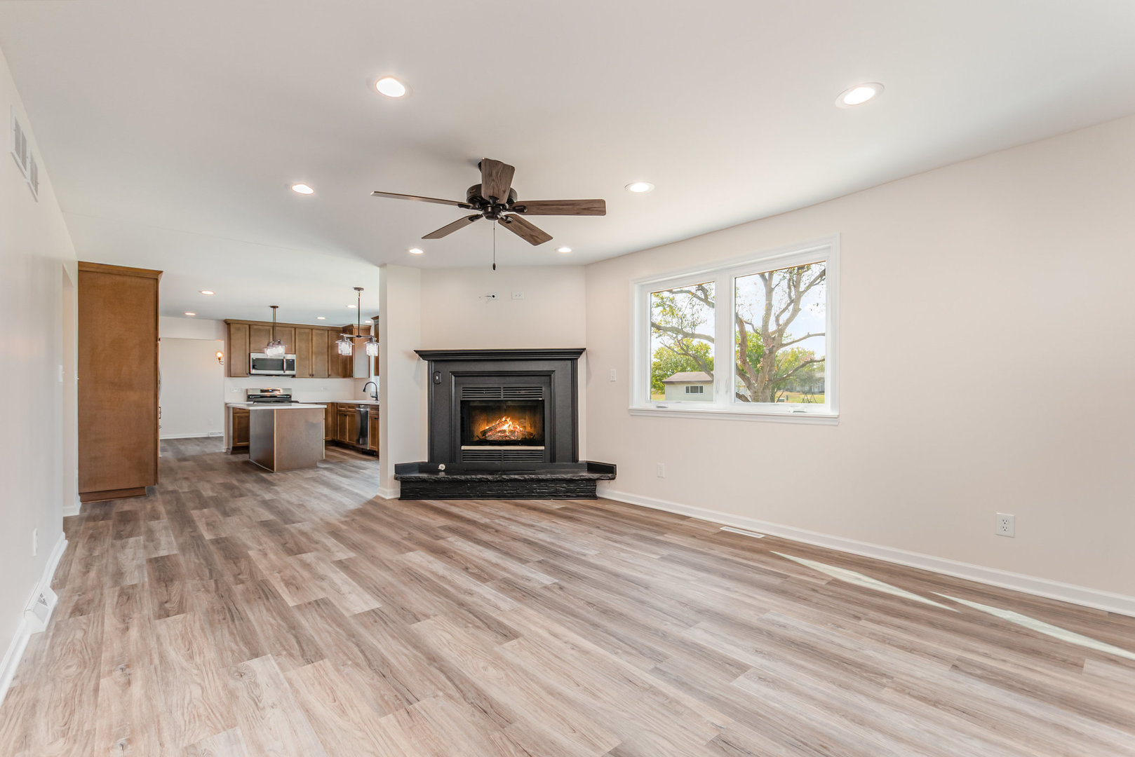 2380 Chestnut Lane Morris, IL 60450 - Photo 3 of 25 a view of an empty room with a fireplace and a window