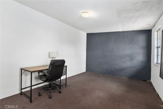 a workspace with furniture and a window