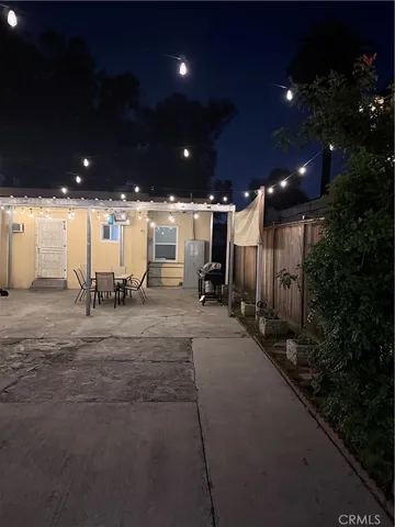 a view of a house with a yard and plants