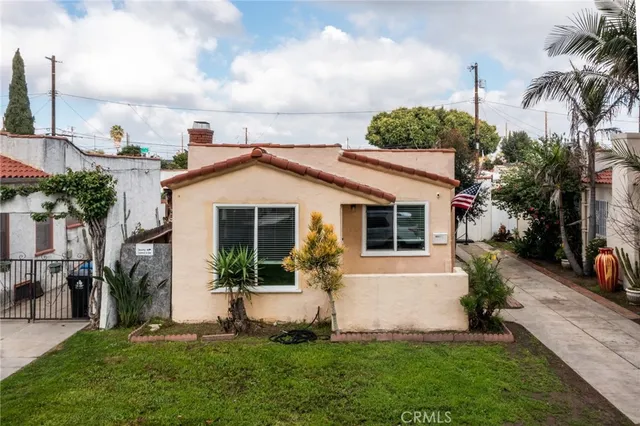 an aerial view of multiple houses with yard