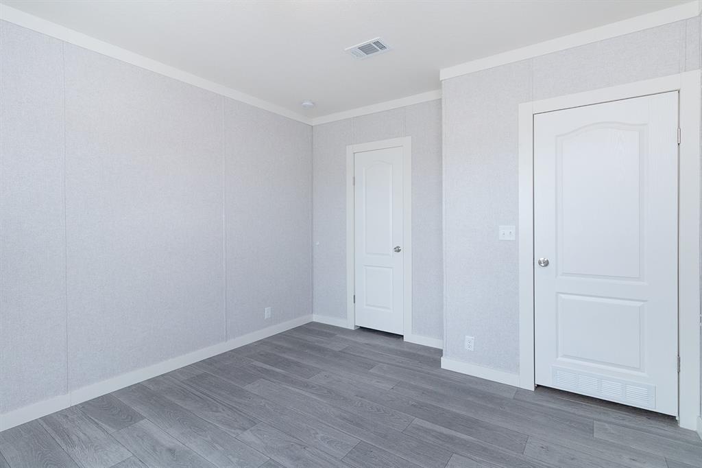 1895 County Road 472 Rochelle, TX 76872 - Photo 24 of 39 a view of an empty room with wooden floor