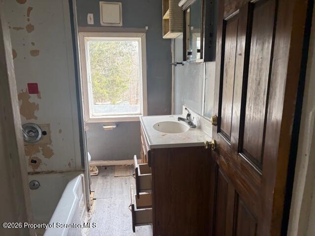 728 Main Street Vandling, PA 18421 - Photo 11 of 17 a bathroom with a bathtub sink and mirror