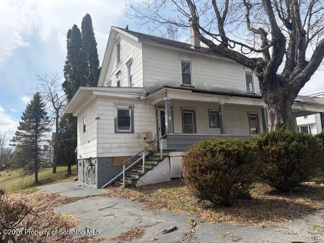 728 Main Street Vandling, PA 18421 - Photo 17 of 17 a view of a house with a large tree and wooden fence