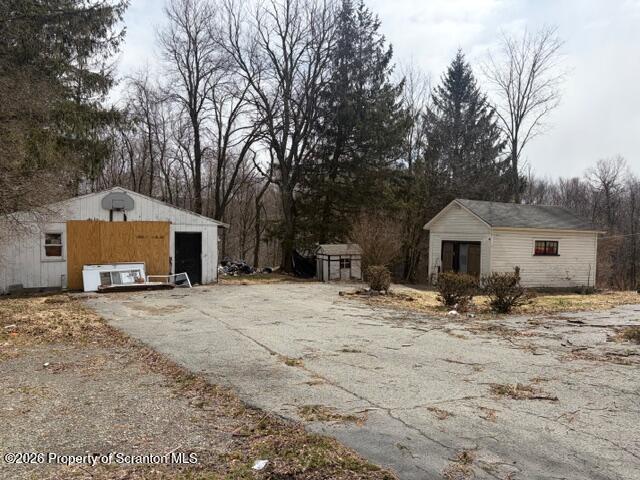 728 Main Street Vandling, PA 18421 - Photo 2 of 17 a big house with trees in front of it