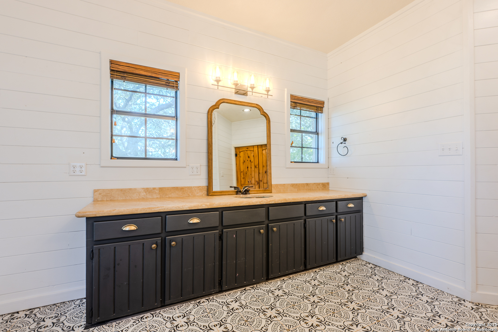 13831 Highway 127 Sabinal, TX 78881 - Photo 14 of 55 a bathroom with a sink and a mirror