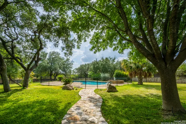 a view of a swimming pool with a garden
