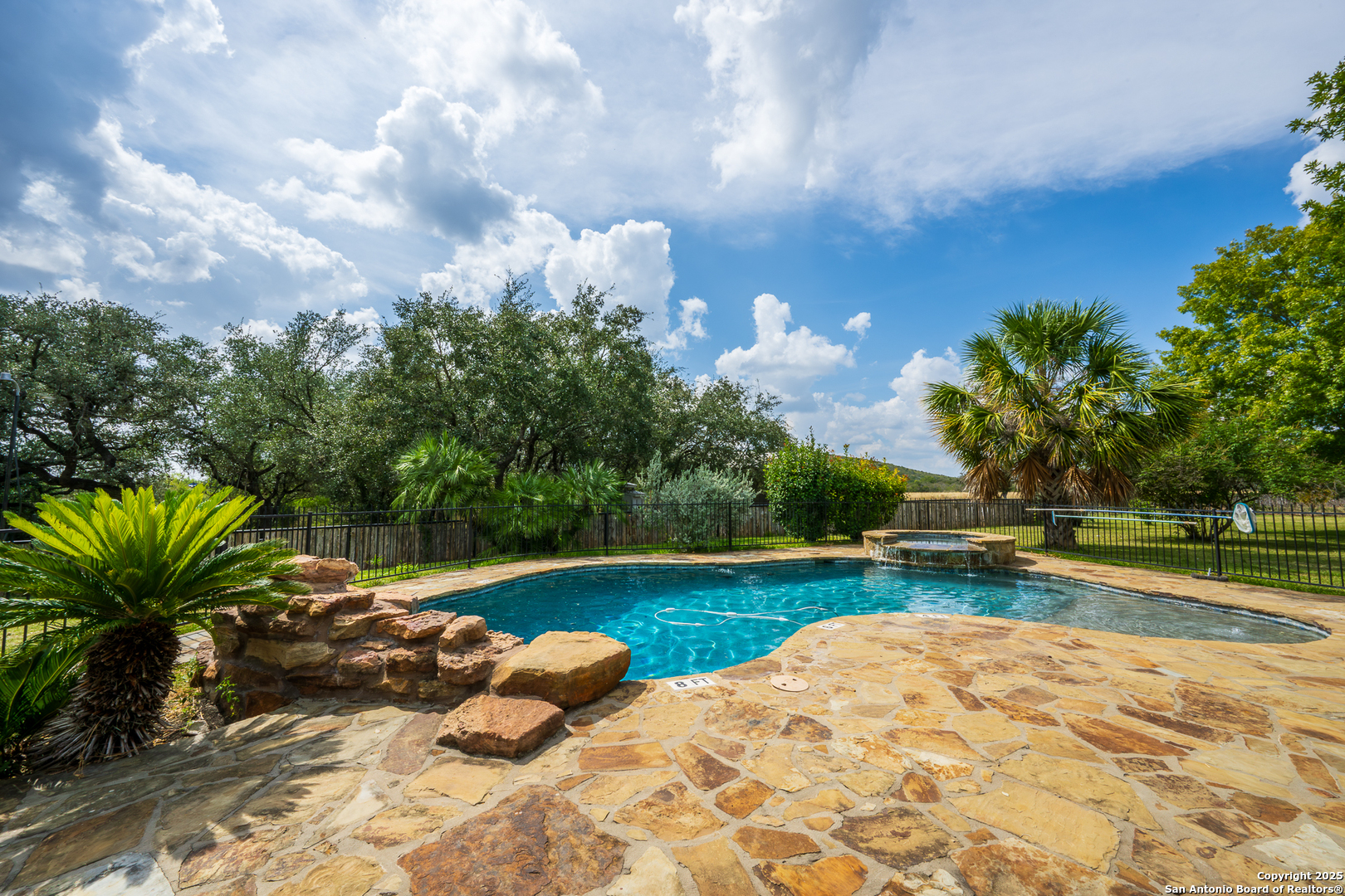 13831 Highway 127 Sabinal, TX 78881 - Photo 32 of 55 a view of back yard with swimming pool and seating