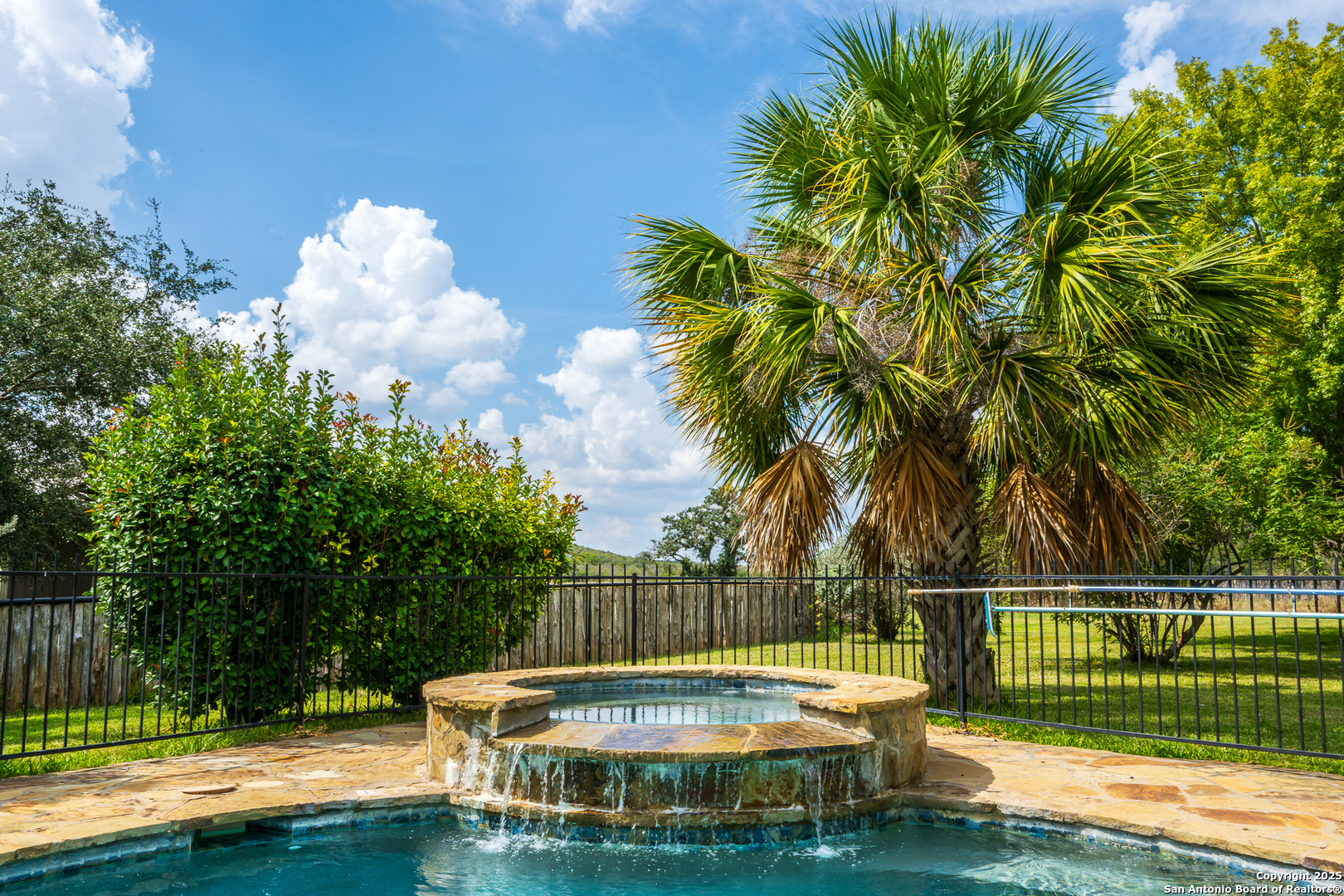 13831 Highway 127 Sabinal, TX 78881 - Photo 34 of 55 a view of a swimming pool with a garden