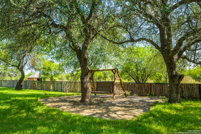 a view of a lake with houses in the background