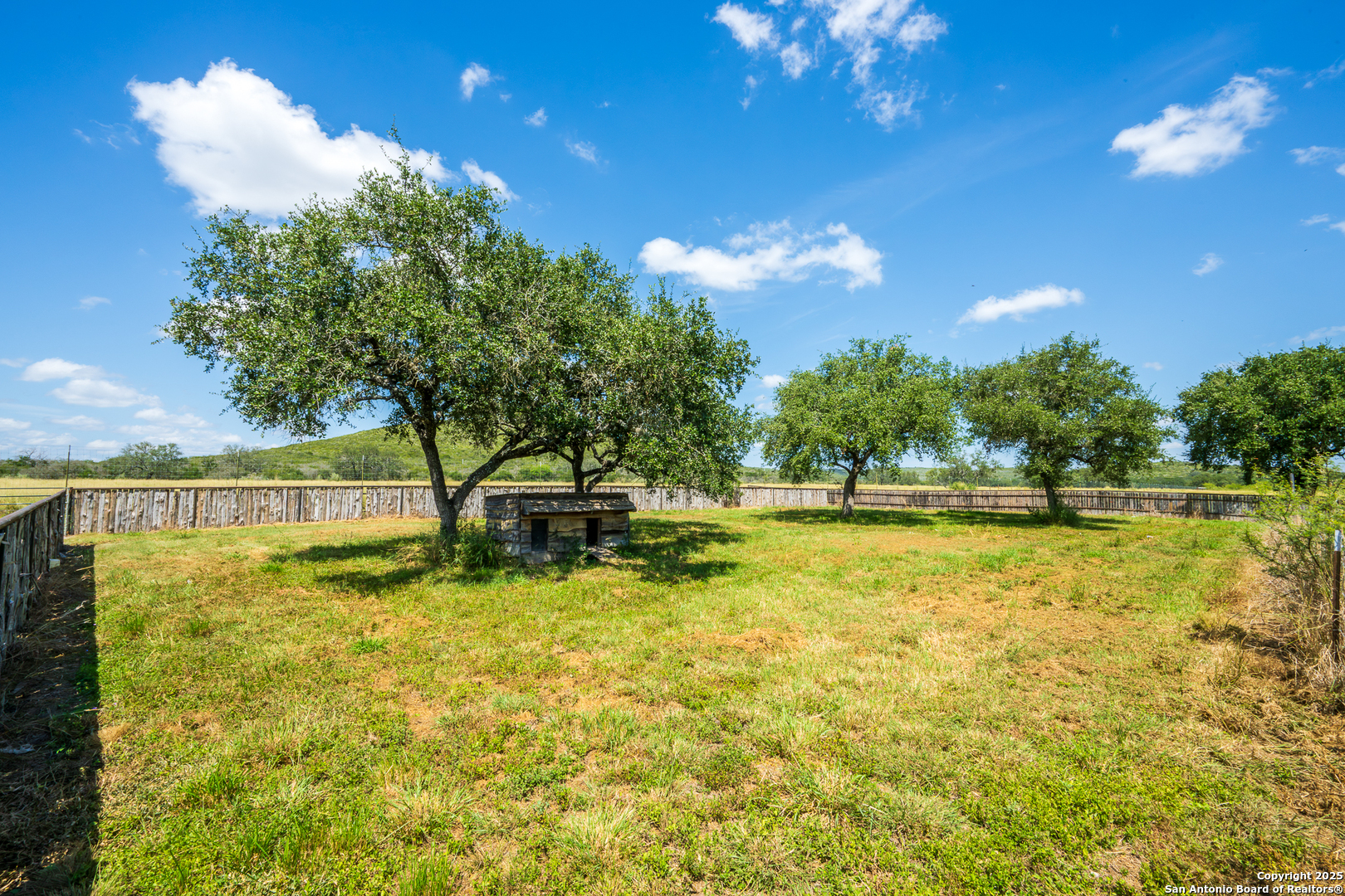 13831 Highway 127 Sabinal, TX 78881 - Photo 47 of 55 a view of a swimming pool with an outdoor space and seating area