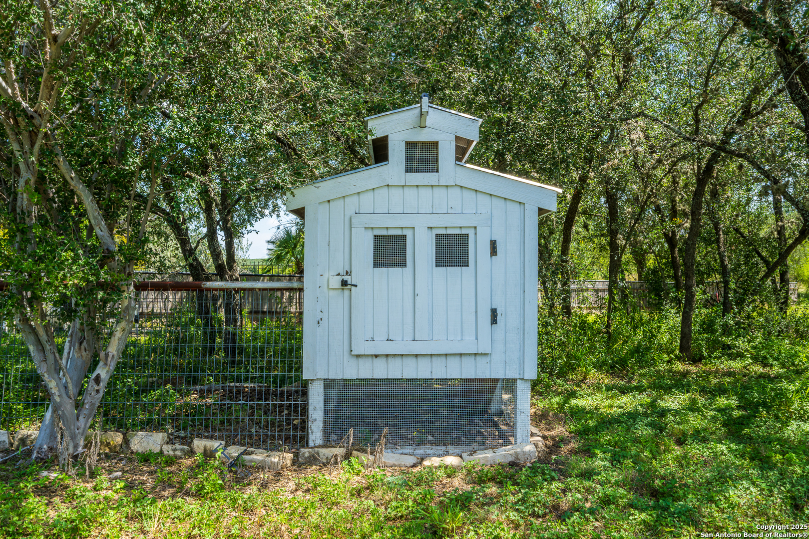 13831 Highway 127 Sabinal, TX 78881 - Photo 49 of 55 a front view of a house with garden