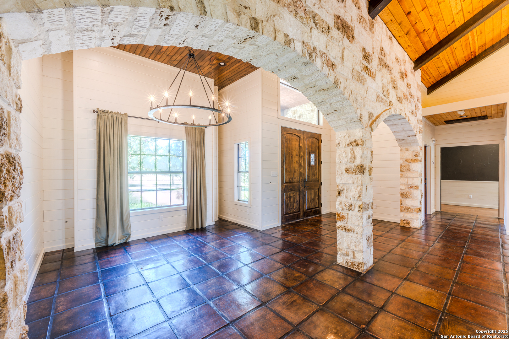 13831 Highway 127 Sabinal, TX 78881 - Photo 6 of 55 a view of empty room with wooden floor and fan