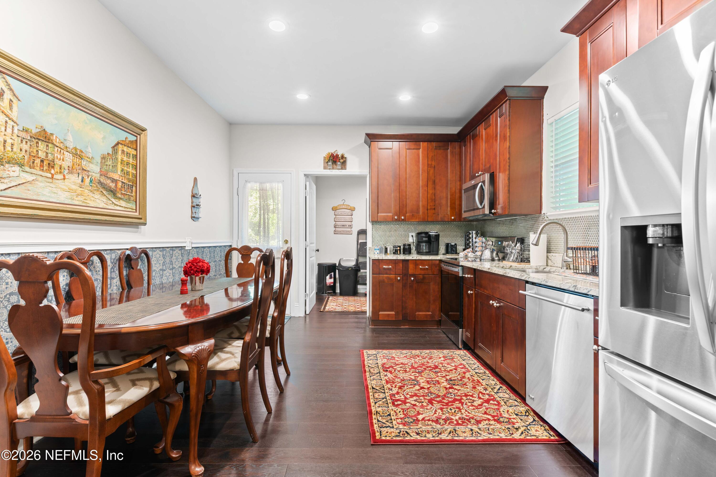 1138 Walnut Street Jacksonville, FL 32206 - Photo 7 of 37 a kitchen with stainless steel appliances granite countertop a refrigerator and a stove top oven