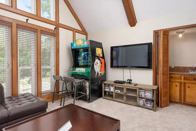 a bedroom with a large bed and a window