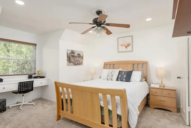 a bathroom with a double vanity sink window and shower