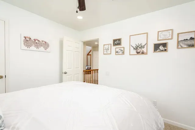 a bathroom with a tub sink double vanity granite and a mirror