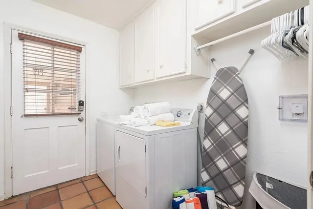 a view of a patio with table and chairs with wooden floor and outdoor seating