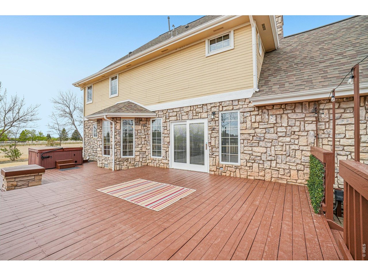 9743 Yellowstone Road Longmont, CO 80504 - Photo 39 of 50 Expansive back deck with a hot tub included