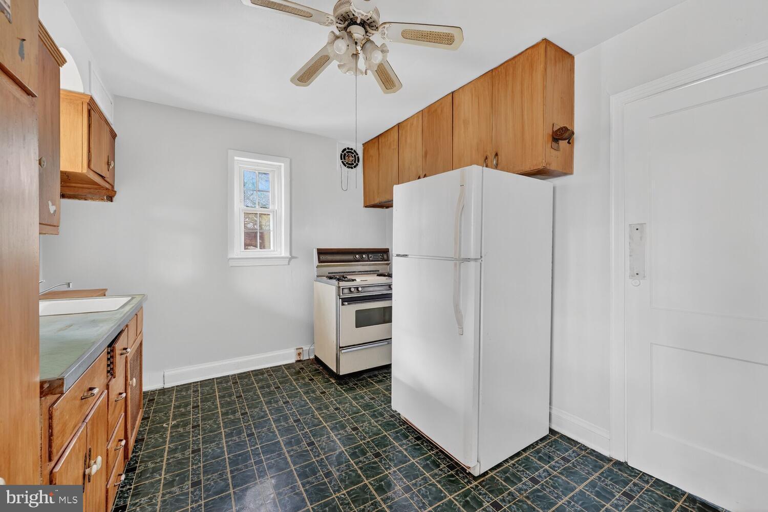 3701 Camden Street Southeast Washington, DC 20020 - Photo 13 of 33 a kitchen with a refrigerator and a stove