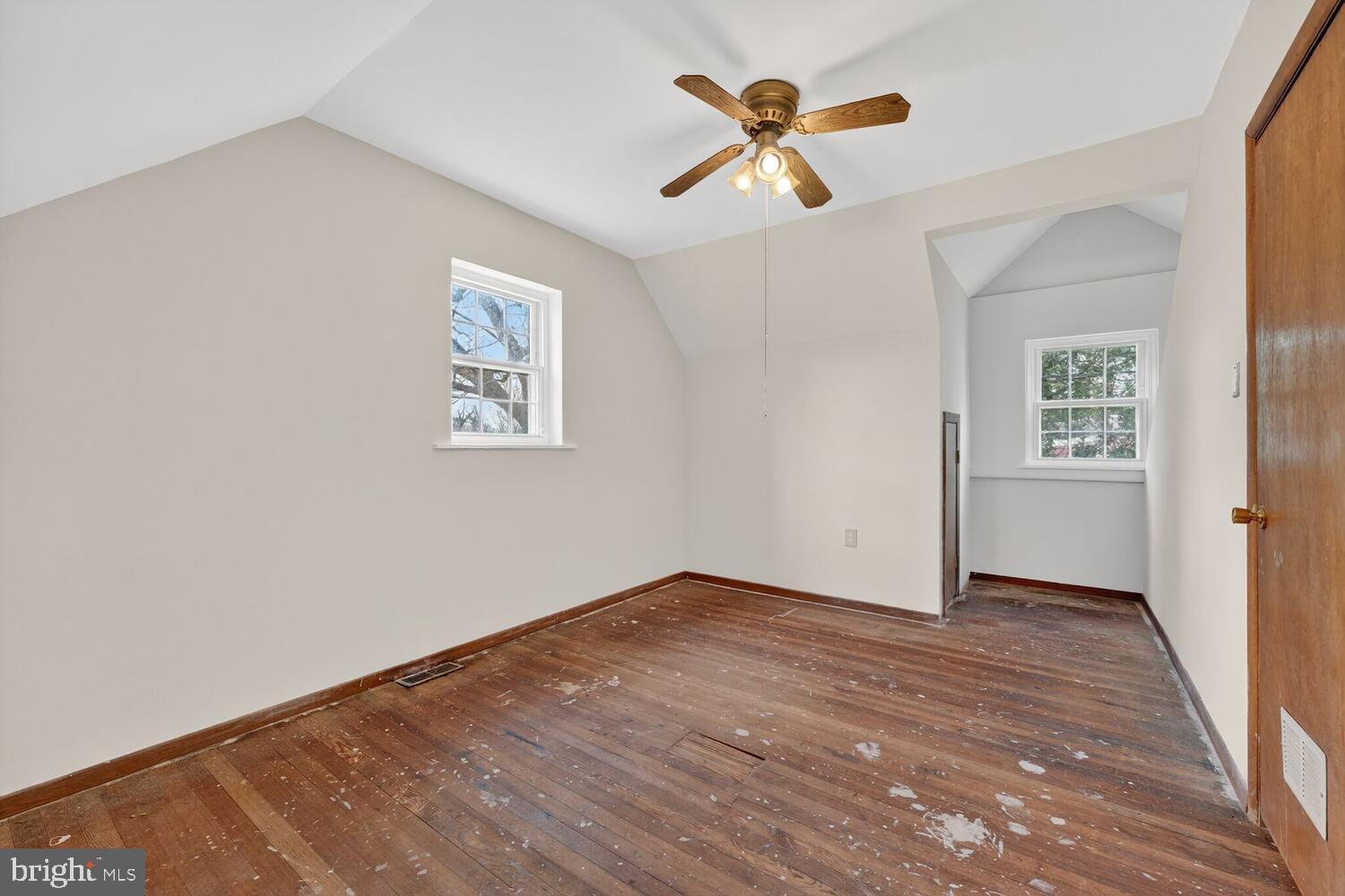 3701 Camden Street Southeast Washington, DC 20020 - Photo 15 of 33 an empty room with wooden floor closet and windows