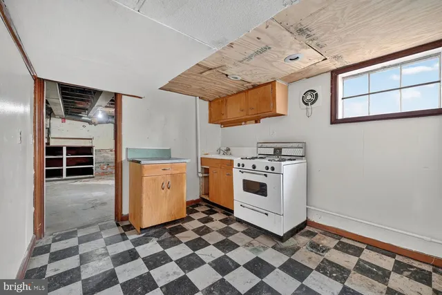 a bathroom with a toilet a sink and a shower