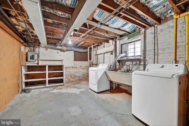 a kitchen with stainless steel appliances and cabinets