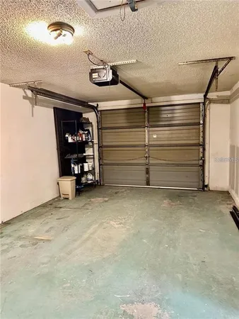 a view of room that has a car parked in it