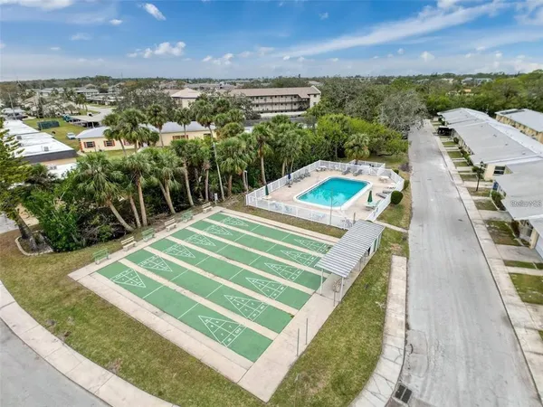 a view of a swimming pool with a yard