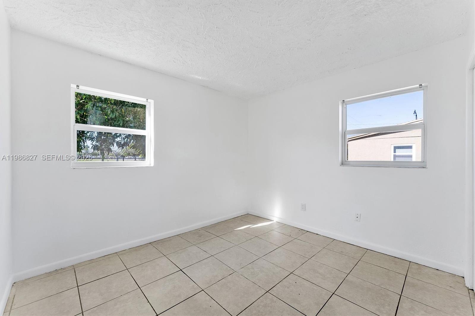 550 Northwest 17th Street Pompano Beach, FL 33060 - Photo 11 of 31 a view of an empty room with a window