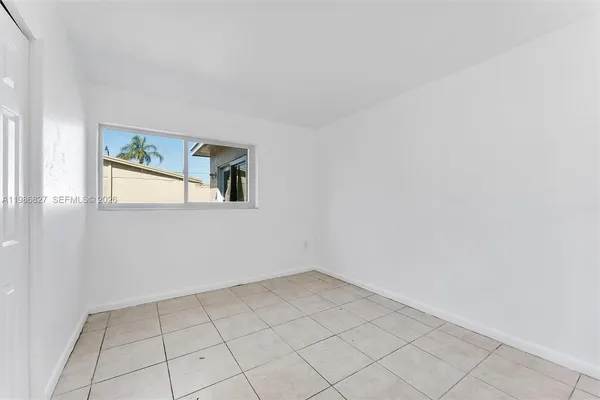 a view of an empty room and window