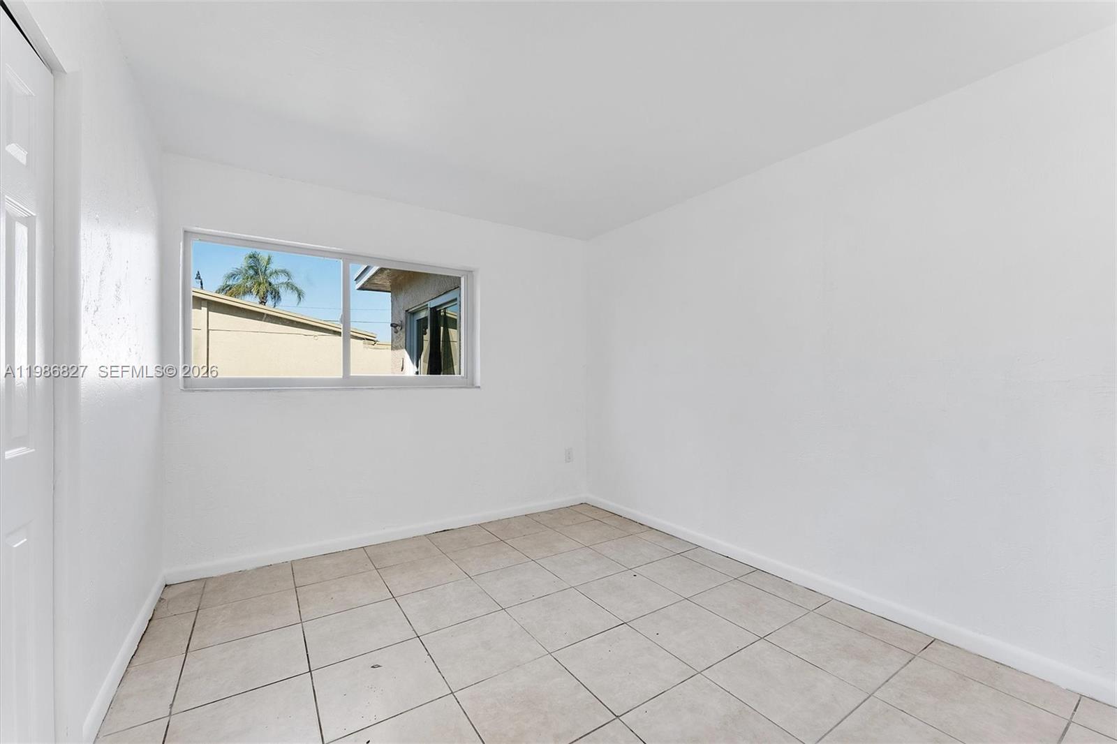 550 Northwest 17th Street Pompano Beach, FL 33060 - Photo 15 of 31 a view of an empty room and window