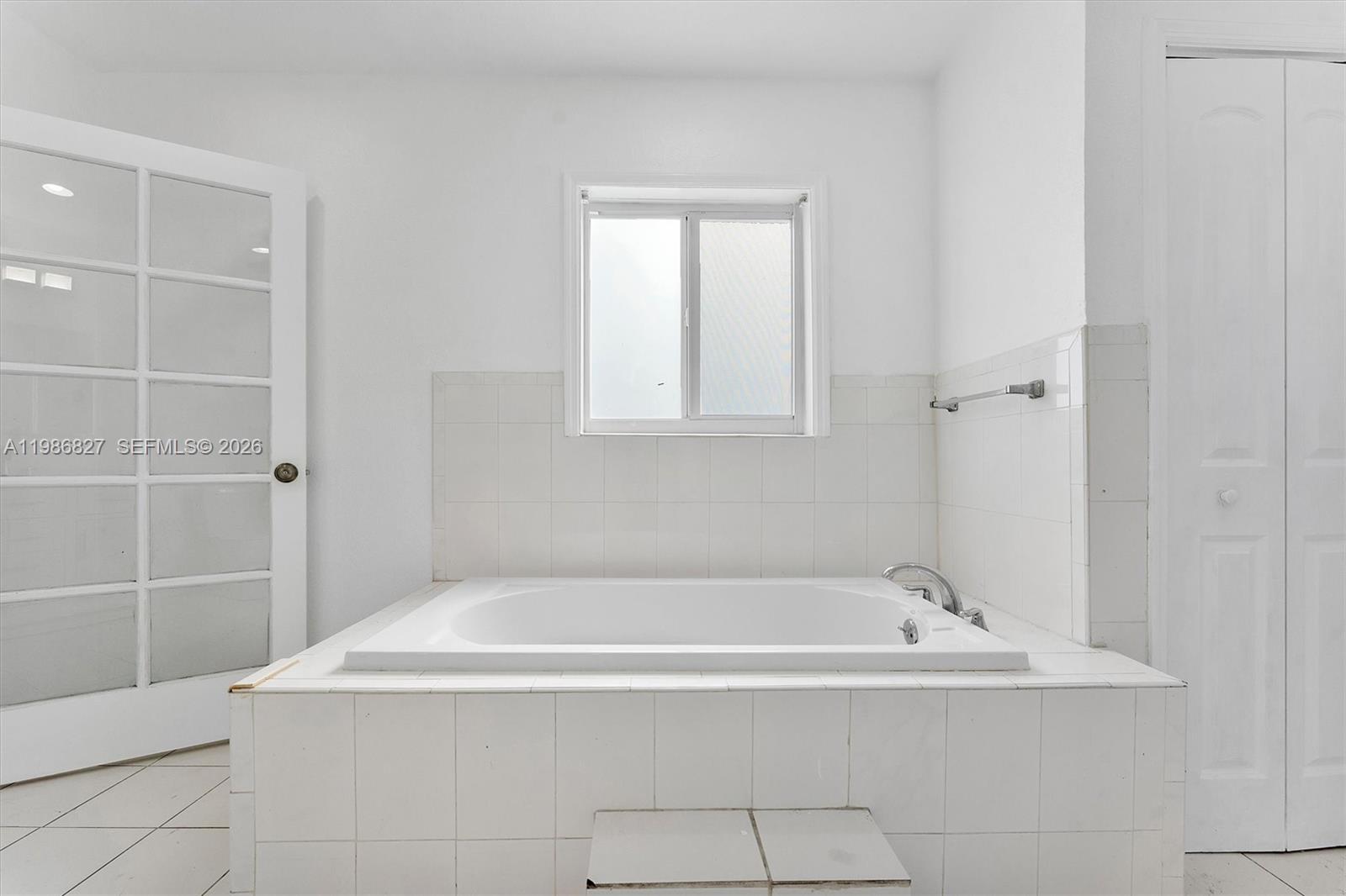 550 Northwest 17th Street Pompano Beach, FL 33060 - Photo 21 of 31 a white bath tub sitting in a bathroom