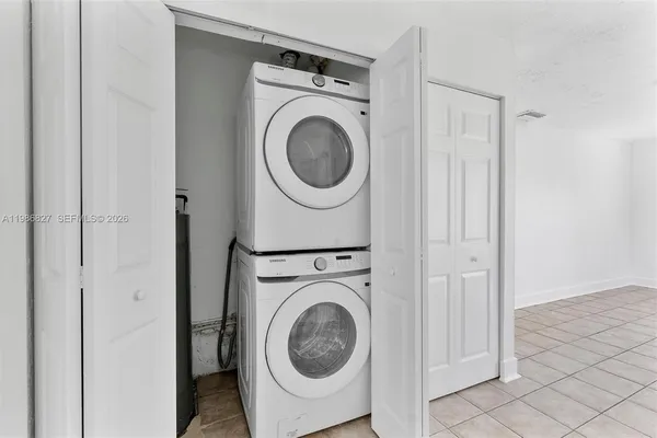 a view of a hallway with washer and dryer