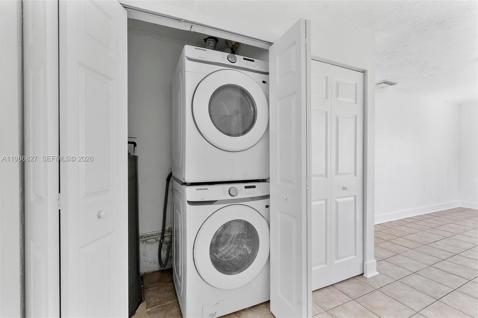 550 Northwest 17th Street Pompano Beach, FL 33060 - Photo 23 of 31 a view of a hallway with washer and dryer