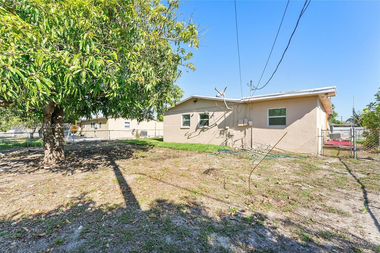 550 Northwest 17th Street Pompano Beach, FL 33060 - Photo 26 of 31 a house view with a backyard space