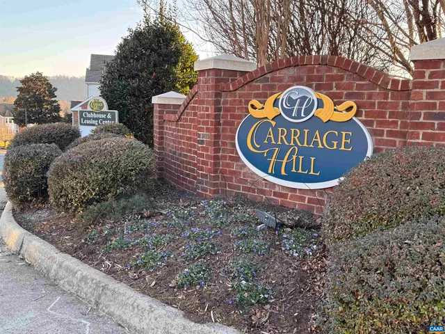 a sign that is on a brick wall