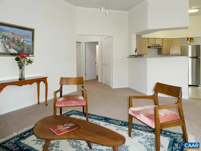 a room with table chairs and wooden floor