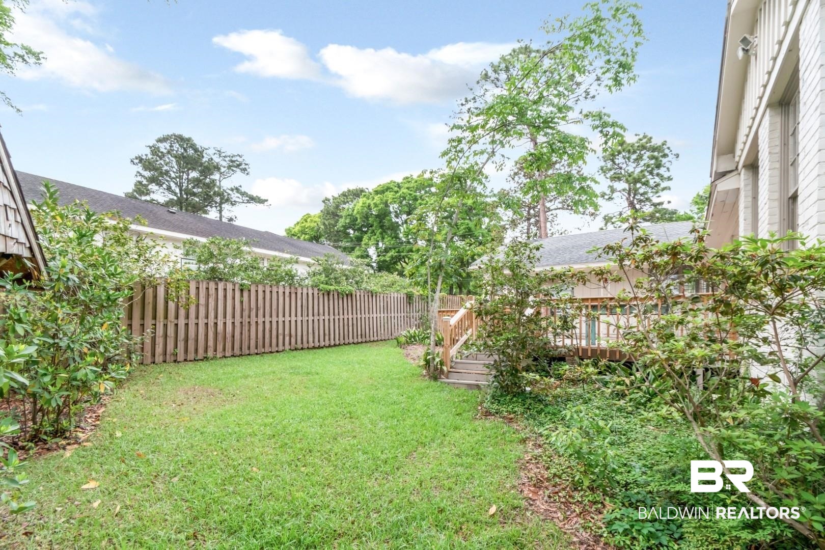 4 Turnout Lane Mobile, AL 36608 - Photo 35 of 53 Fenced backyard with a wooden deck
